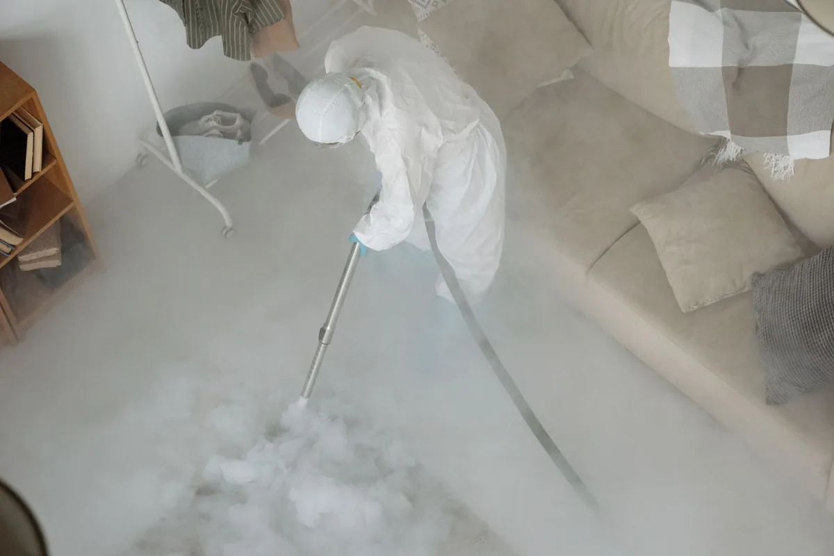 Biohazard cleanup technician in protective equipment, Loring Park, Minneapolis, MN
